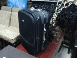 Black suitcase+leather bag