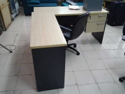L-shaped office desk with chair, keys in office