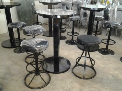 Black round bar table with 3 stools