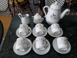 A small 15 piece Chinese coffee set white with gilt flowers for 6 persons