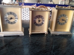 3 brass clocks
