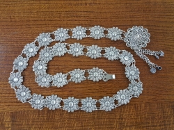 A belt with flowers designs. 105 grams