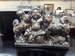 A very large metal Japanese hunter and 2 dogs ornament