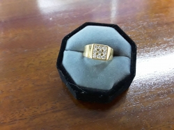 A very nice ladies on gents cold plated ring with nine diamantes stones-stand