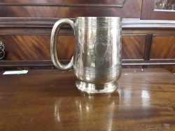 A nice silver plated highly embossed tankard