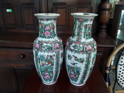 A pair of hand painted Chinese vases