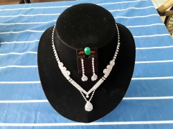 Beautiful lady's silver necklace and matching earrings with diamantes stand not included