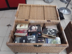 Job lot of books in rattan case