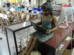Bronze lady read book