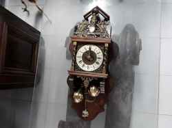 Wooden clock with pendulums and working
