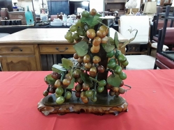 Jade grapes on wooden vest