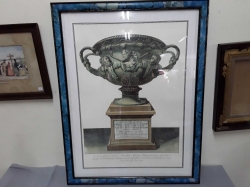 A prints of Roman vase in blue frame
