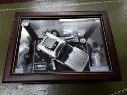 Car model in wood frame