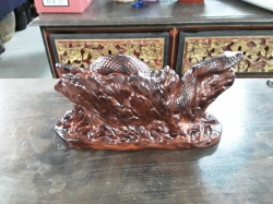 A nice porcelain snake winding around a tree