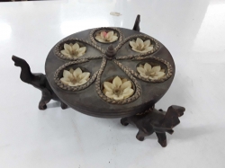 Wooden candle holder with elephants