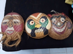 Three Vietnamese masks,painted on rattan