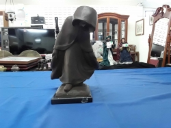 Antique man walking on marble base