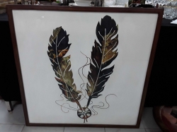 Frame painted of cowboy artifacts