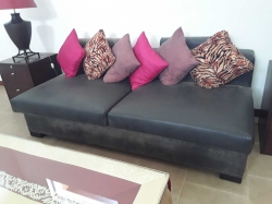 Leather sofa with cushions