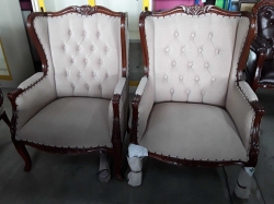 A pair of French wing arm chairs