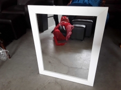 A mirror in white frame