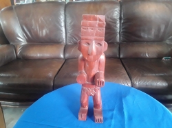 Wooden statue man with broken ear