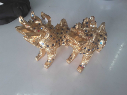 A pair of gilt & coloured glass Chinese dogs of Foo
