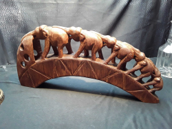 An old hardwood carved procession of A 5 elephant family
