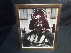 A framed Darth vadar photo (star wars)