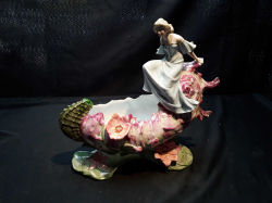 A lovely fine porcelain table ornament with lady on a boat