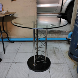 Rounded tempered glass table with Stainless pedestal and black granite base