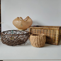 A selection of hand woven rattan baskets in various sizes and shapes