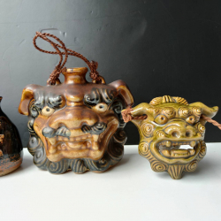 An old whisky bottle and a plaque in shape of Foo dog face , 2x hand painted pottery vases