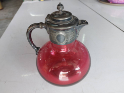 A Victorian cranberry tinted claret jug Lot 733