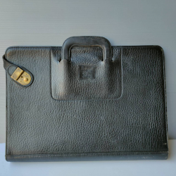 A Burberry leather briefcase with the key