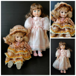 Two beautiful Vintage Porcelain dolls the sitting one with built in music