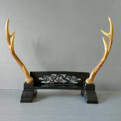 A pair of imitation stag deer display on stand