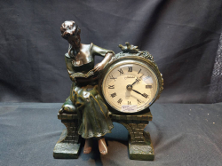 A beautiful Lady sat on bridge reading a book with quartz ornament clock