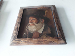 An oil on canvas framed of an old man smoking a pipe