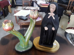 A Large Figurine of a Nun and Candle Holder