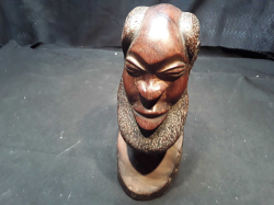 A carved wooden head (9 inches high)