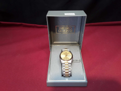 Seiko Mens Quartz Watch With Gold Dial, Day & Date Feature, Two Tone Band, and Fresh Battery. In The Original Box - Excellent Condition