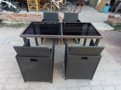 A Artificial Rattan Dinner Table and 4 Chairs.