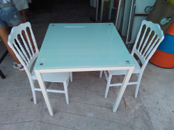 1 Square Table and 2 White Chairs.
