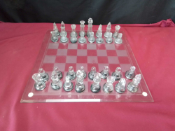 Glass Chess Set on Glass Chess Board . 