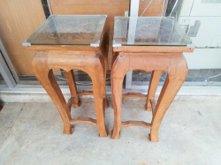 A Pair of Carved Side Tables Glass tops. W.30 H.72 Cm.