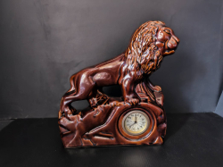 A vintage German porcelain figure of Lion with clock