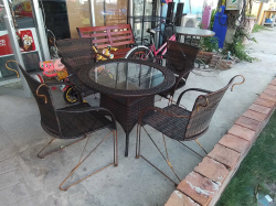 A Lovely Outdoor Inside  Iron & Rattan Chairs & Table set with Tempered Glass Top.
