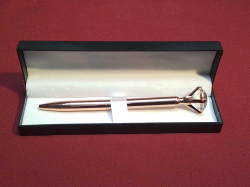 A Lovely Gold Pink Pen with diamond top.