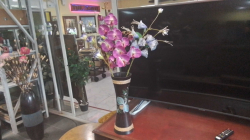 A Wooden Pot with Artificial Orchids. H.44 Cm.